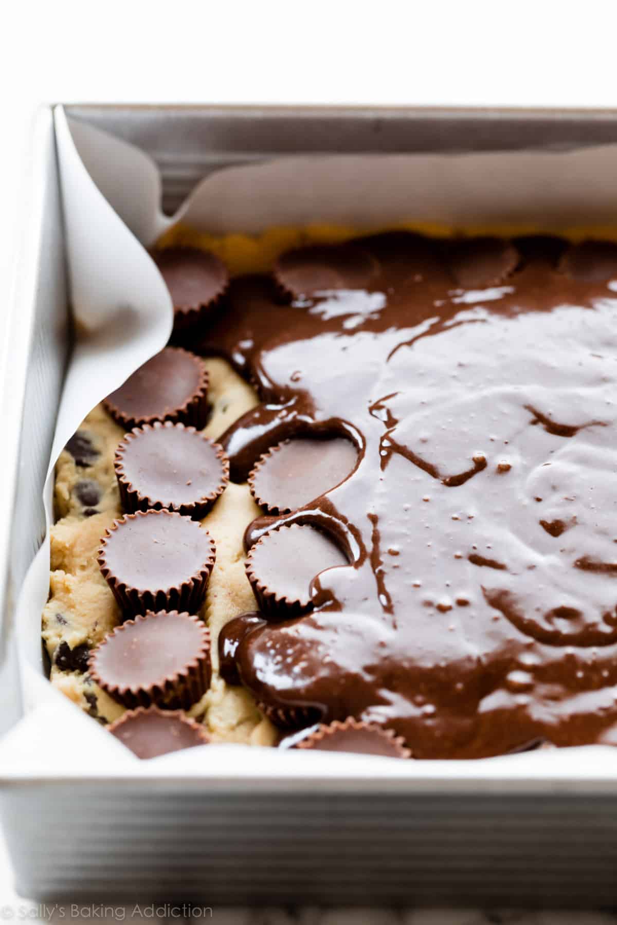 Baking pan with cookie dough and brownie batter