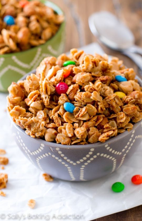 honey roasted peanut butter granola in a gray and white bowl