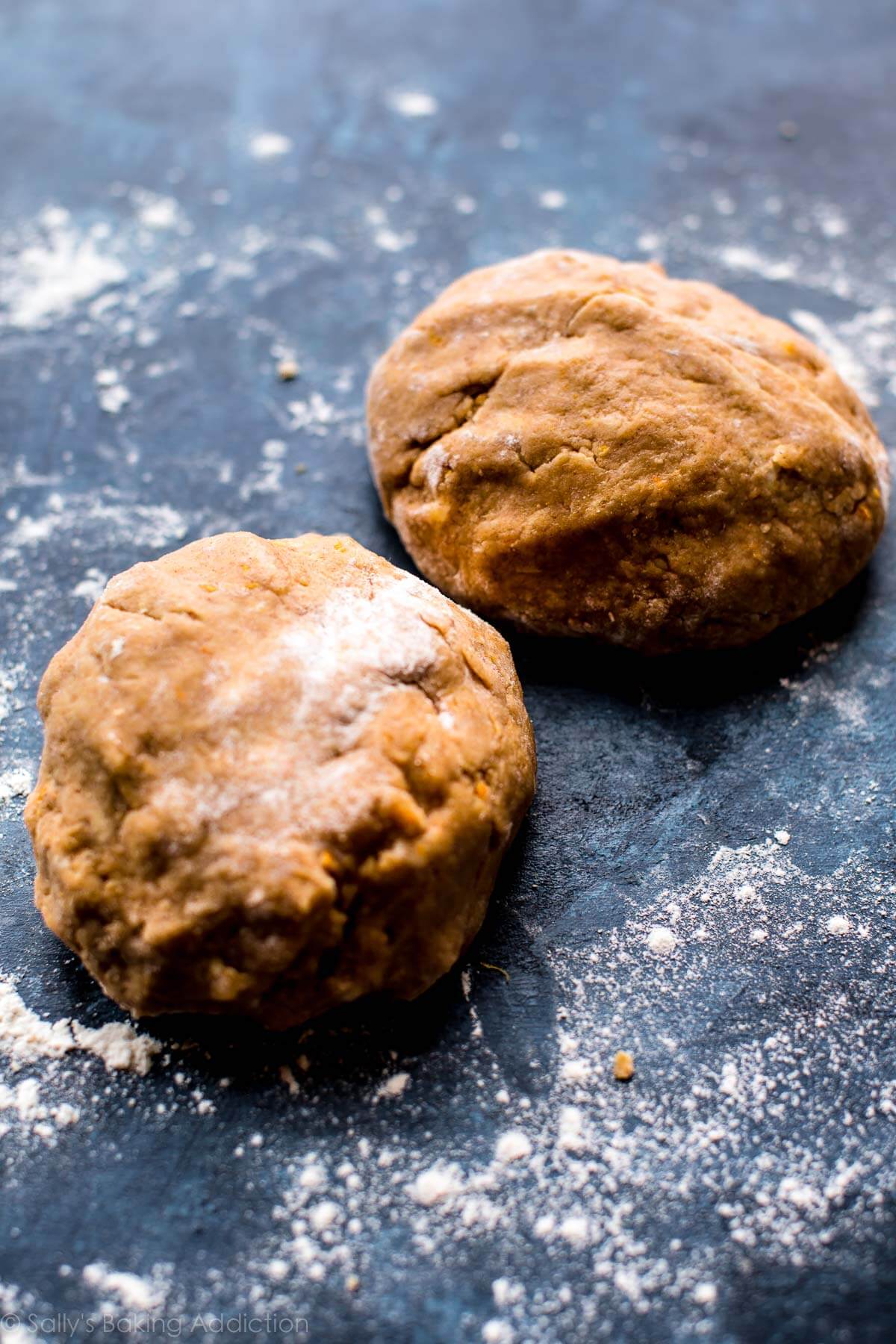 2 balls of orange biscotti dough