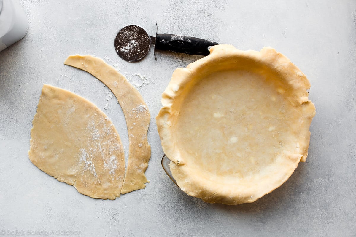 pie dough in a pie dish before baking