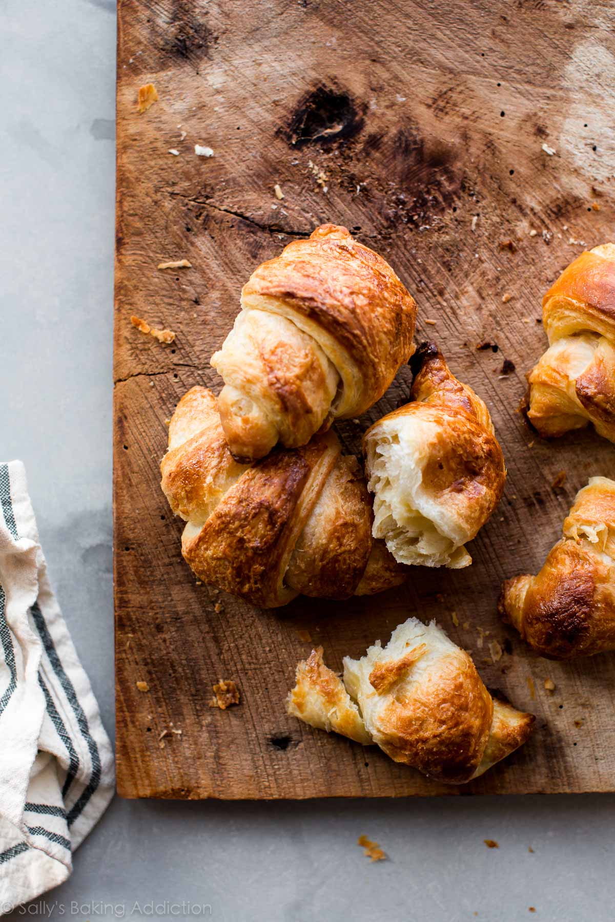 croissants on a wood serving tray