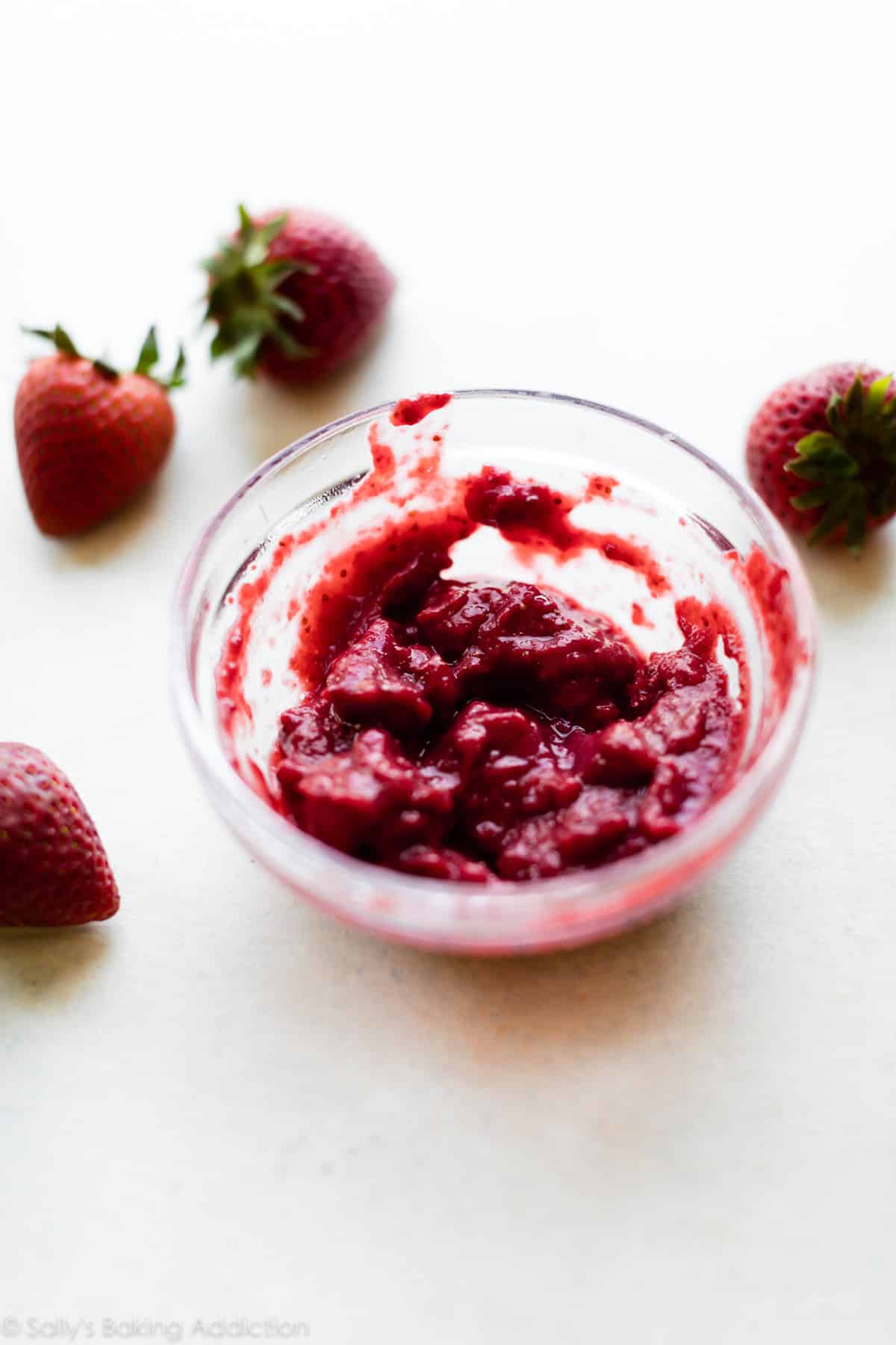 Reduced strawberry puree in a glass bowl