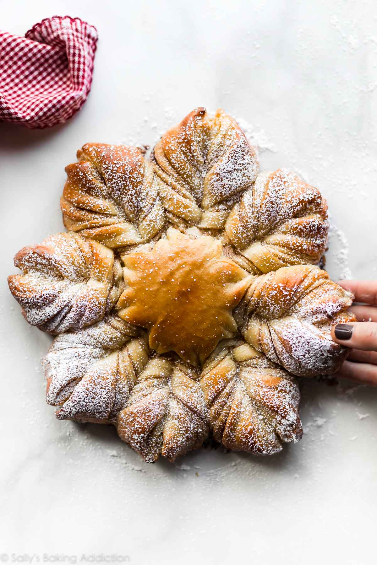 star bread with a hand pulling a section apart