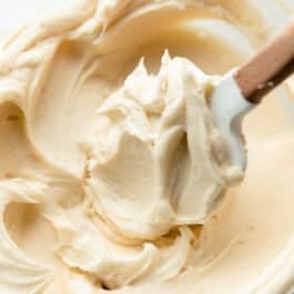 Champagne frosting in glass bowl with spatula