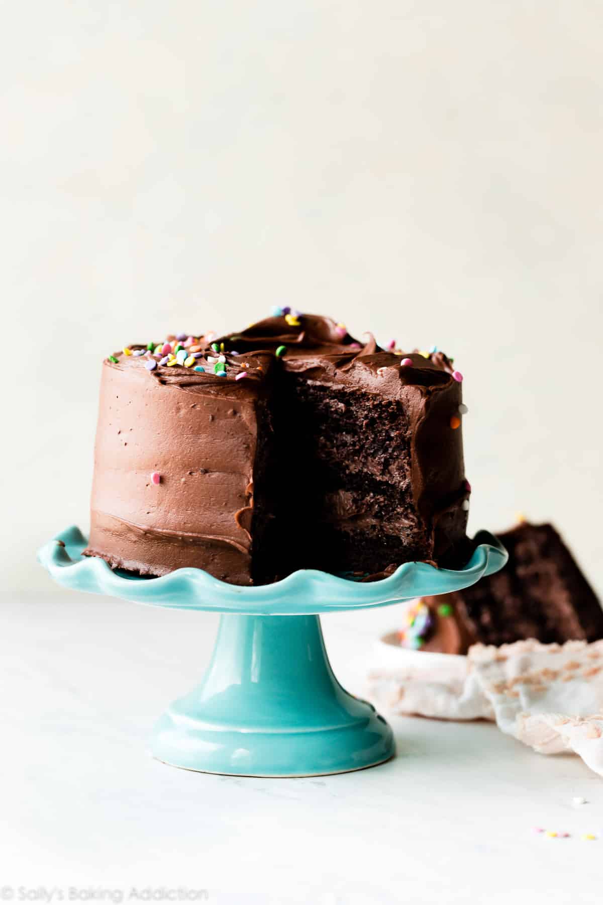 6 inch chocolate cake on blue cake stand