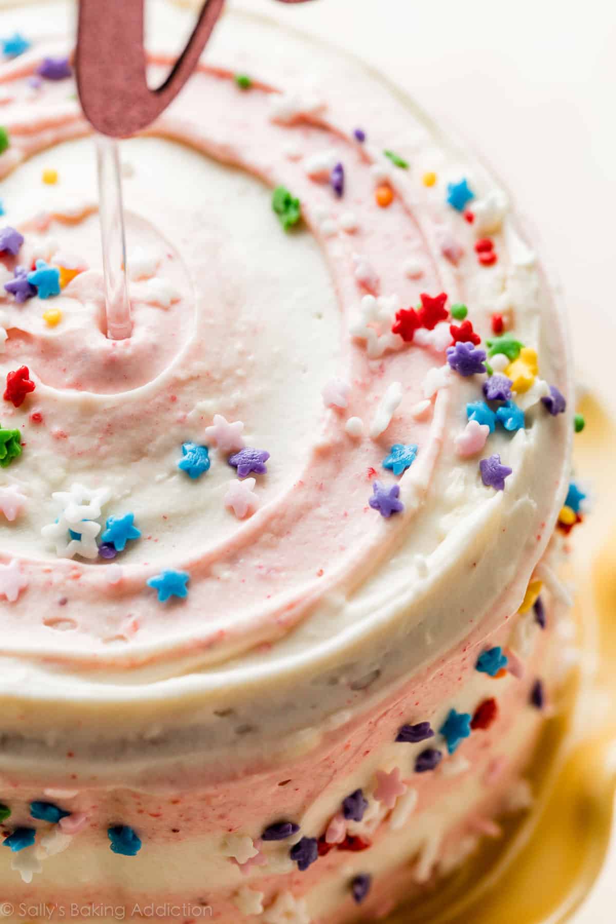 1st birthday cake with pink strawberry frosting