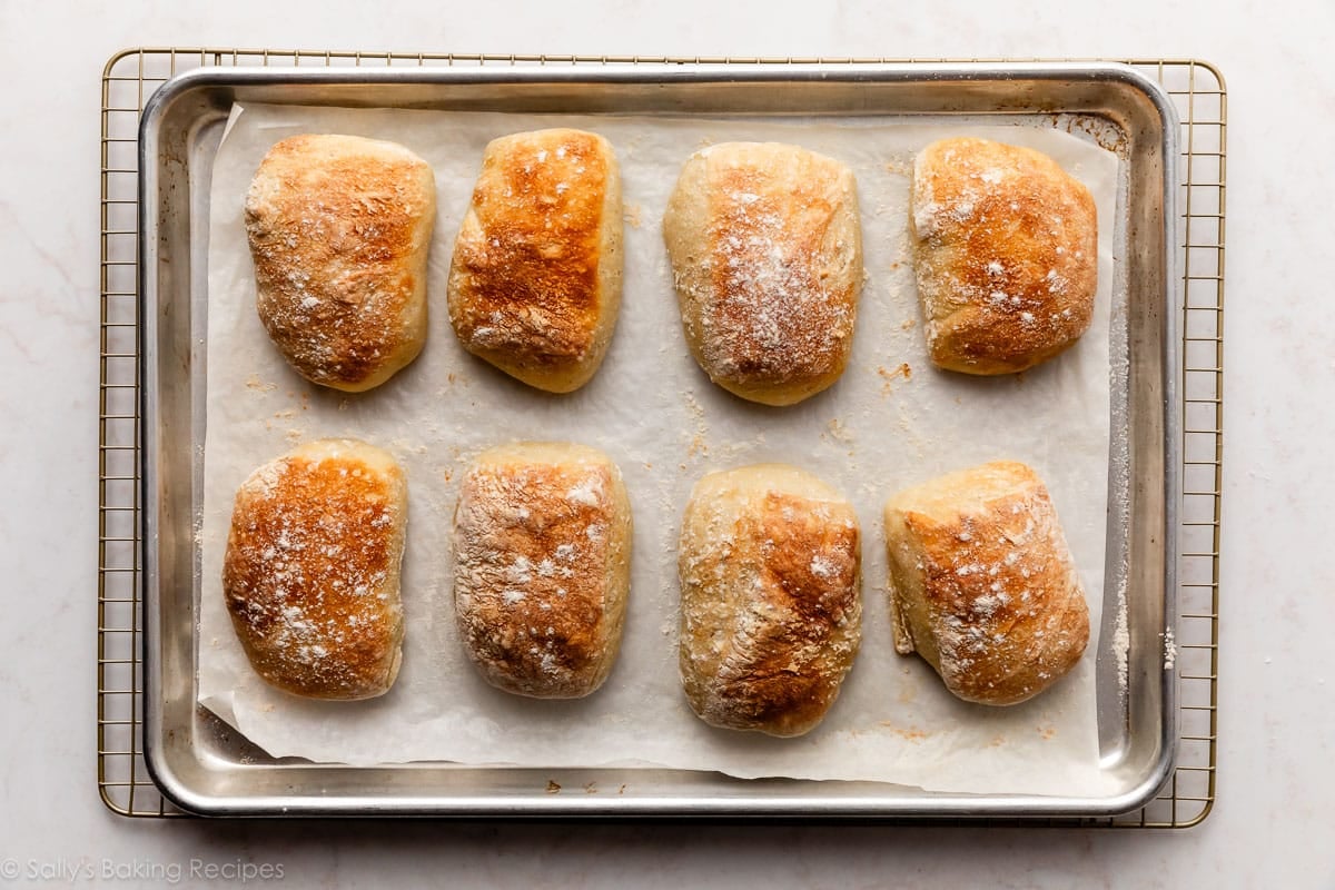 ciabatta rolls on lined baking sheet.